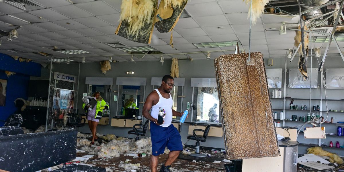 Employees Collecting Their Things From A Salon Hit By A Tornado