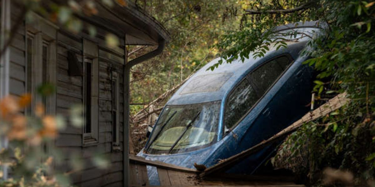 Car Resting Alongside A House