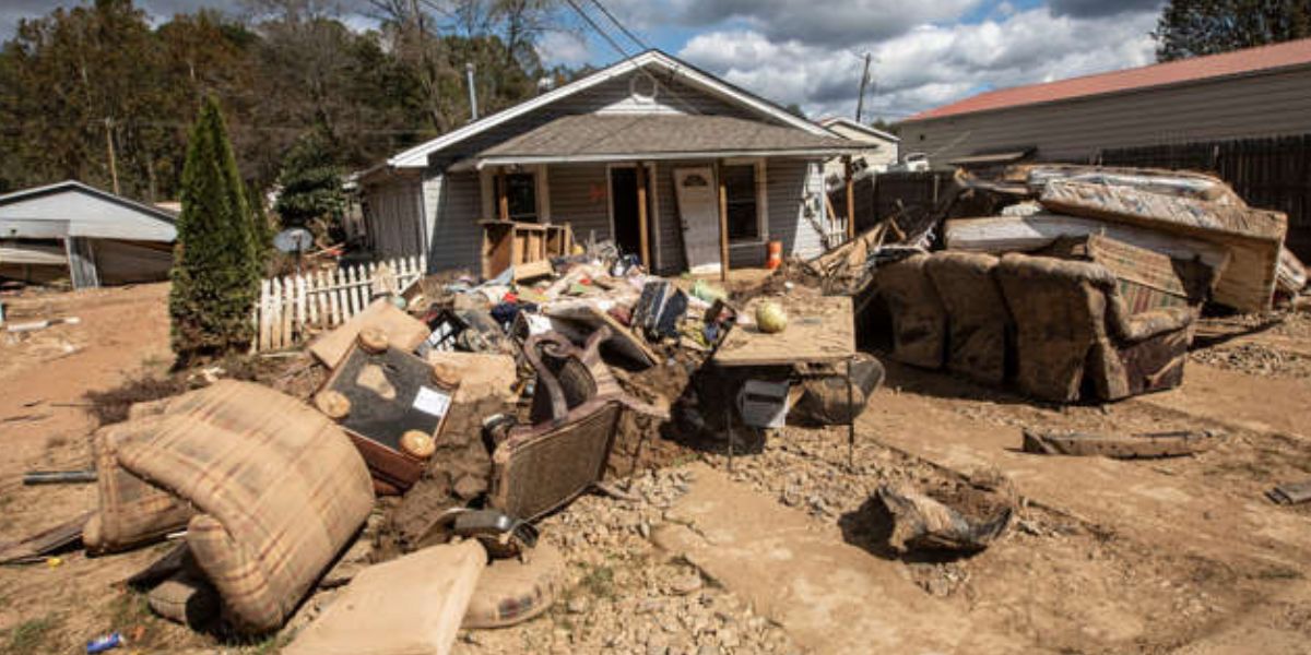 Damaged Belongings Piled Up Outside Houses