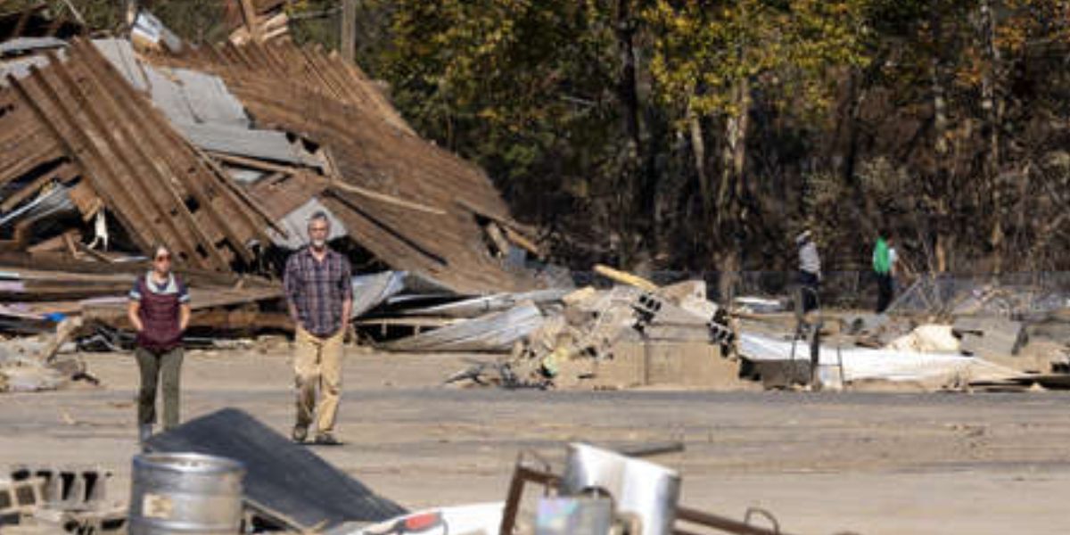 Derek Rinaldo And Alison Lively Inspect The Damage