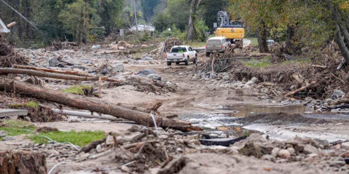 Local Residents Drive On The Washed Out Roads