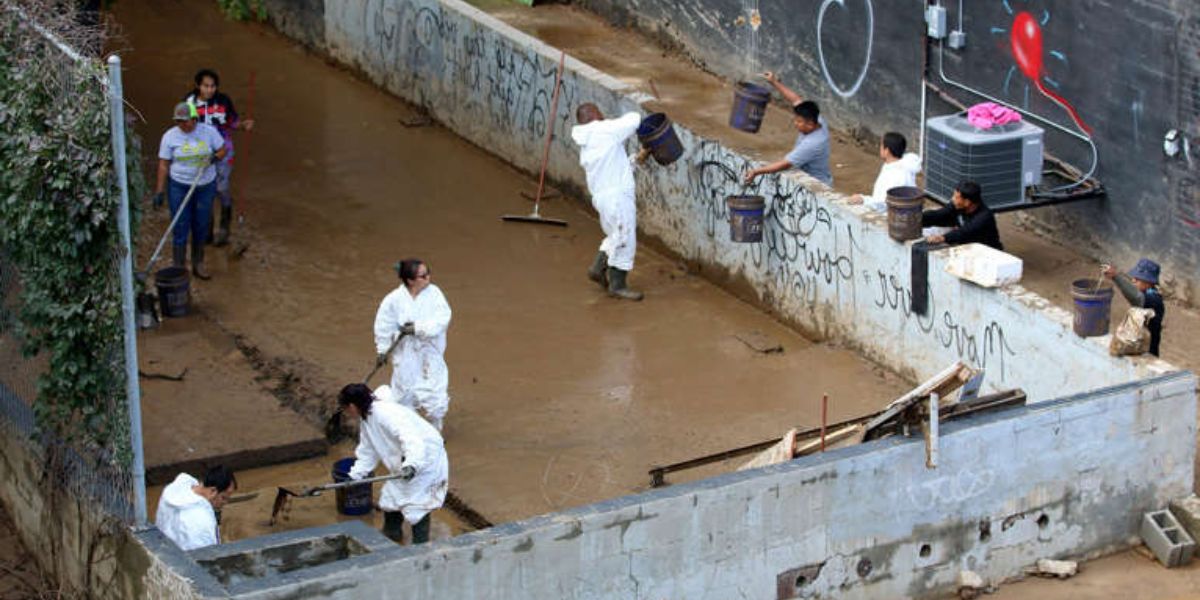 Residents Clean Up The Mud Along The Paynes Way