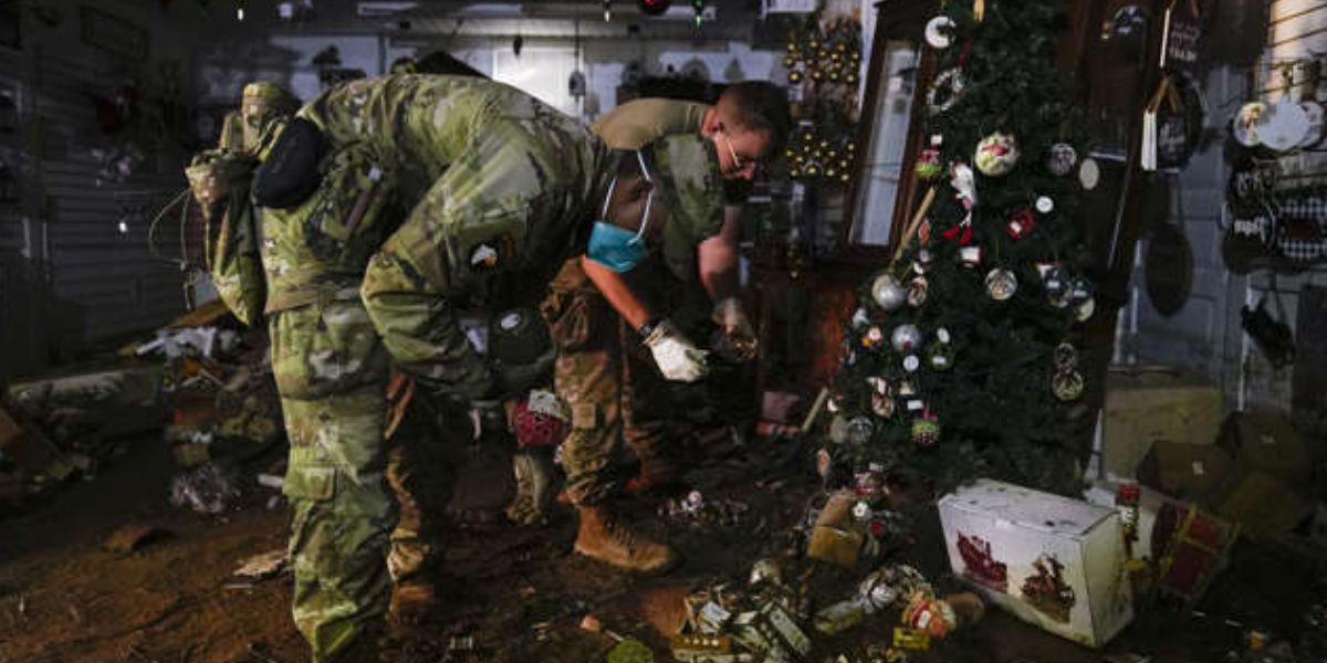 Soldiers Help In Cleaning Out Mud From Gale's Chimney Rock Shop