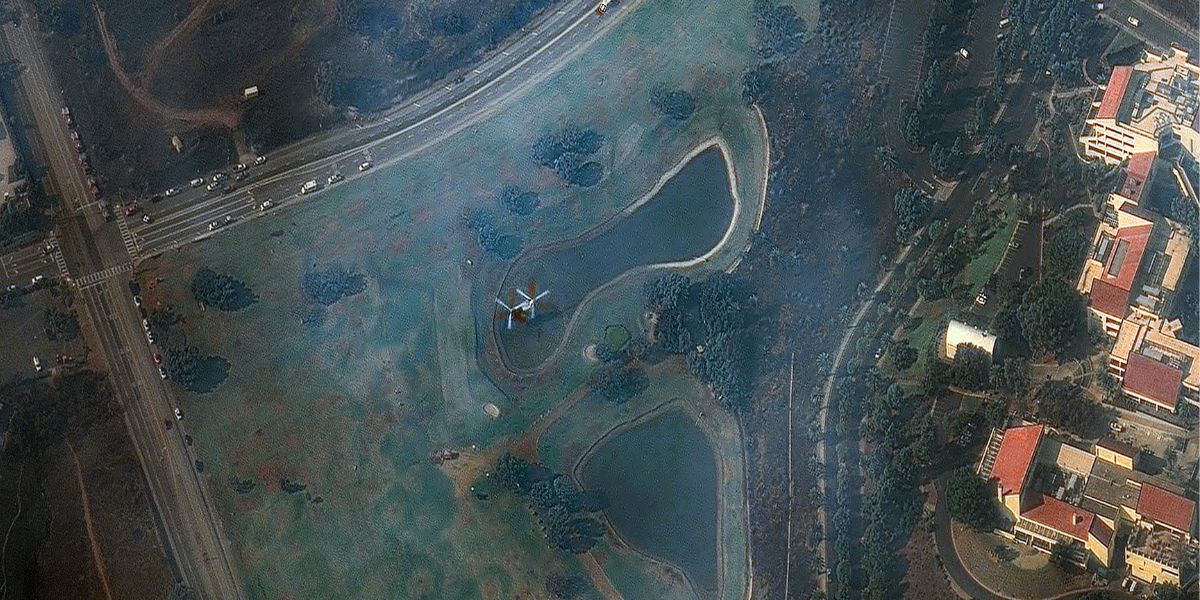 Satellite image showing helicopter taking water from a pond