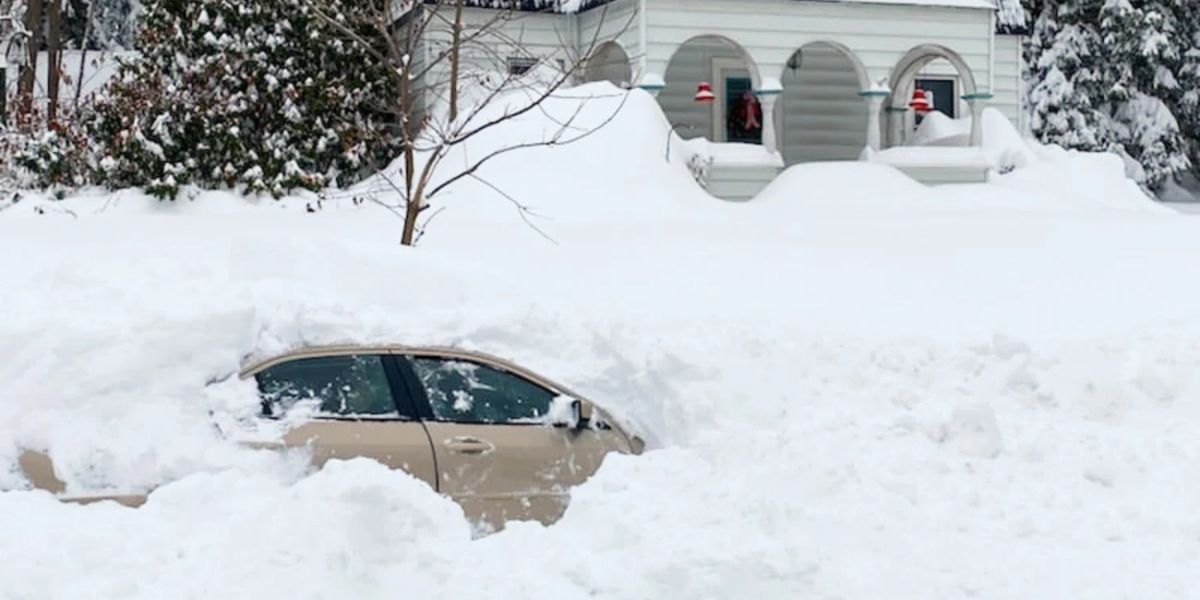 Snowfall in New York bury vehicles