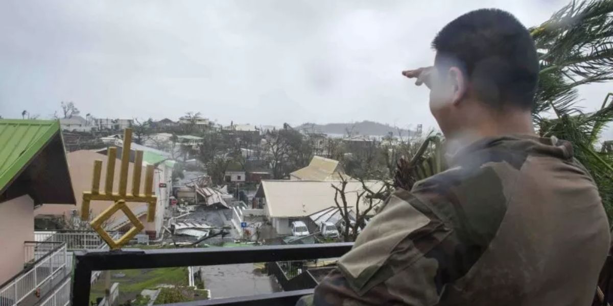 Soldier Looks At The Damage Caused By Cyclone Chido