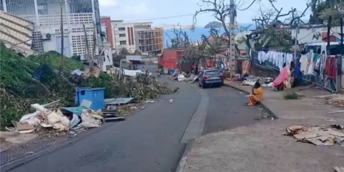 Women Sitting On A Devastated Street In Mayotte